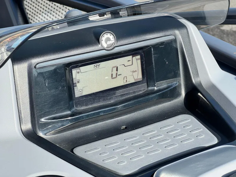 Slide: The Image of 2023 Sea-Doo Switch Sport 18 dashboard with digital display and BRP logo. - 24