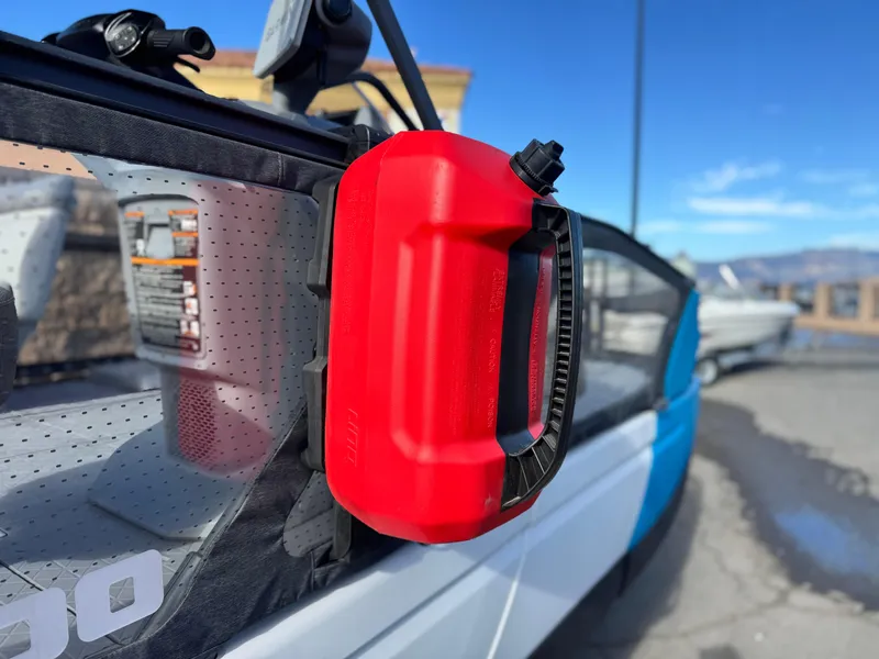 Slide: The Image of Red fuel container on 2023 Sea-Doo Switch Sport 18 boat, sunny day background. - 9