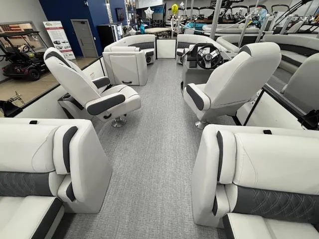 Slide: The Image of 2025 Harris Sunliner 230 boat interior with luxurious seating and modern design. - 16