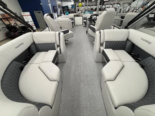 Slide: The Image of 2025 Harris Sunliner 230 interior with luxurious seating and modern design. - 17