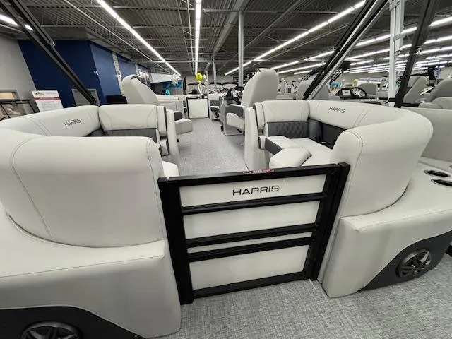 Slide: The Image of 2025 Harris Sunliner 230 pontoon boat interior with plush seating and modern design. - 18