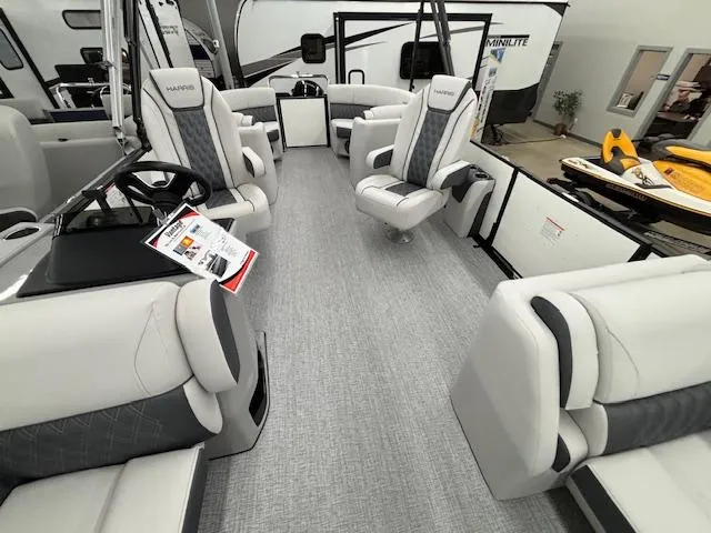 Slide: The Image of 2025 Harris Sunliner 230 boat interior with luxurious seating and modern design. - 24