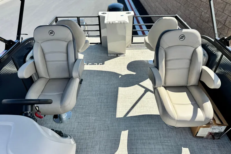 Slide: The Image of Luxurious seating on 2025 Flagship E22RF boat, featuring plush beige captain chairs. - 12