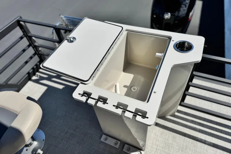 Slide: The Image of Fishing station on Flagship E22RF boat, featuring a storage compartment and cup holder, 2025 model. - 15