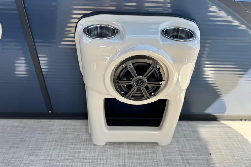 Slide: The Image of 2025 Flagship E22RF speaker system with dual cup holders on a boat deck. - 16
