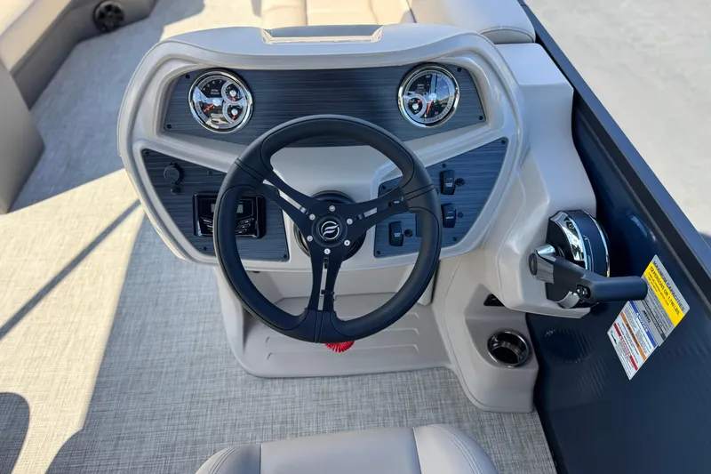 Slide: The Image of Steering console of 2025 Flagship E22RF boat with modern controls and gauges. - 19