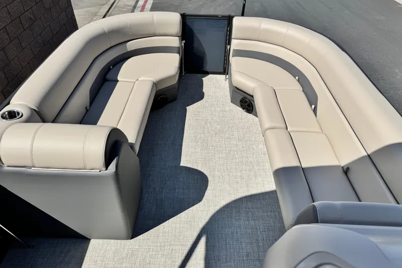 Slide: The Image of Luxurious seating on 2025 Flagship E22RF boat, featuring plush beige upholstery and modern design. - 9