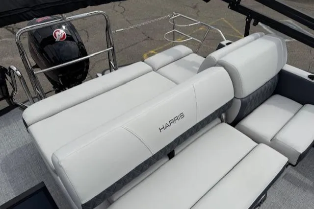 Slide: The Image of 2025 Harris Sunliner 230 boat with luxurious seating and modern design. - 10