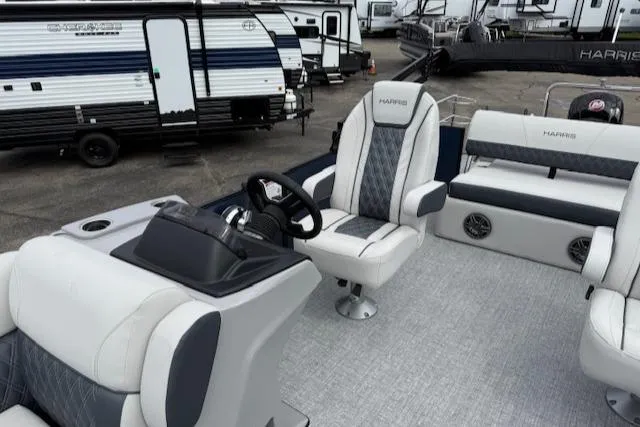 Slide: The Image of 2025 Harris Sunliner 230 boat interior with modern seating and steering console. - 12