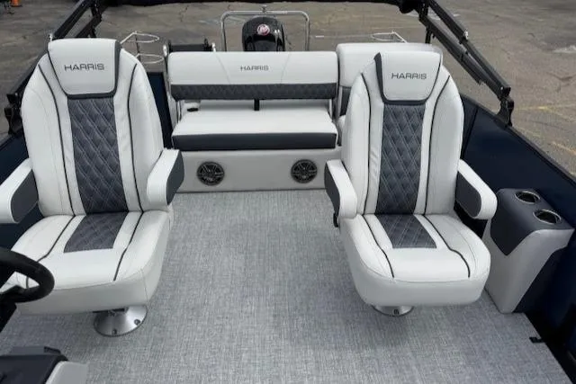 Slide: The Image of 2025 Harris Sunliner 230 boat interior with luxurious seating and modern design. - 13