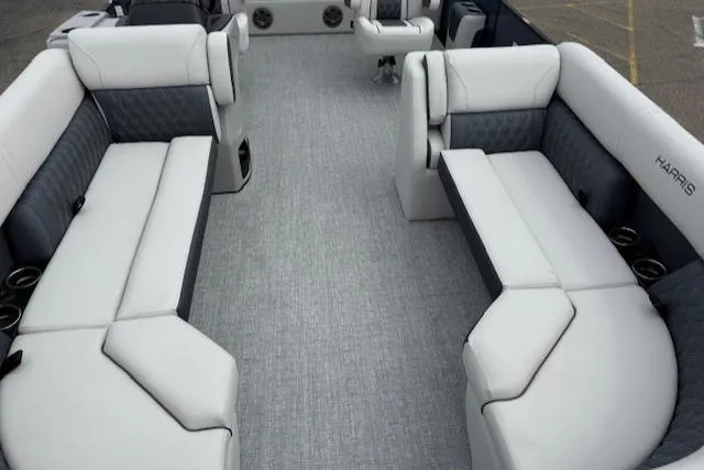Slide: The Image of 2025 Harris Sunliner 230 boat interior with luxurious seating and modern design. - 14