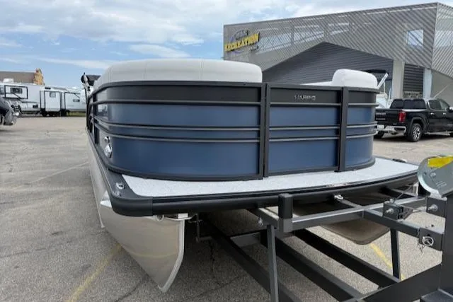 Slide: The Image of 2025 Harris Sunliner 230 pontoon boat on trailer in parking lot. - 21