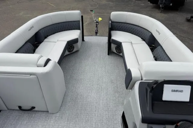 Slide: The Image of 2025 Harris Sunliner 230 boat interior with gray seating and modern design. - 6