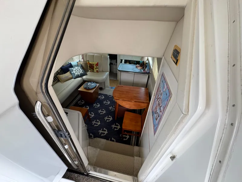 Slide: The Image of Interior of 1997 Sea Ray 370 Aft Cabin with cozy seating and nautical decor. - 14