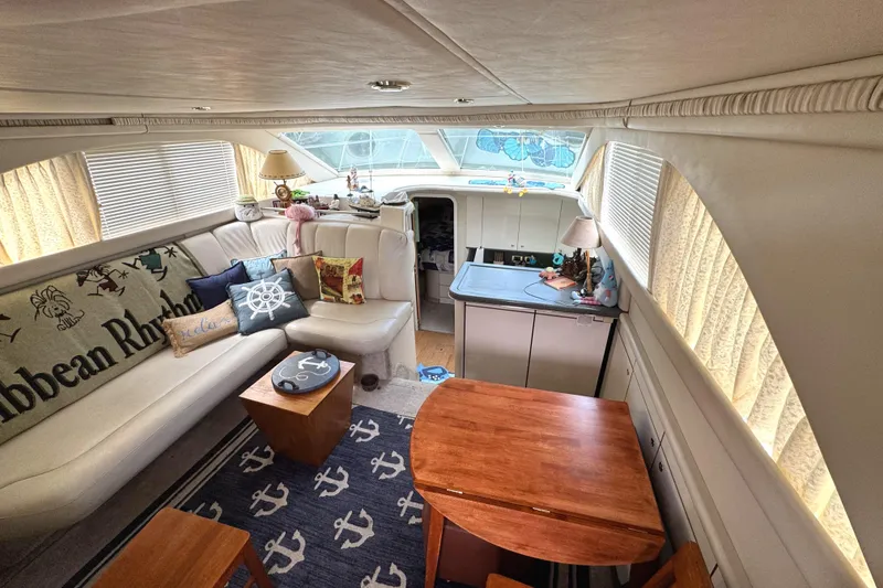 Slide: The Image of Interior of 1997 Sea Ray 370 Aft Cabin with cozy seating and nautical decor. - 15