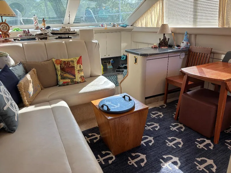 Slide: The Image of Interior of 1997 Sea Ray 370 Aft Cabin with cozy seating and nautical decor. - 16