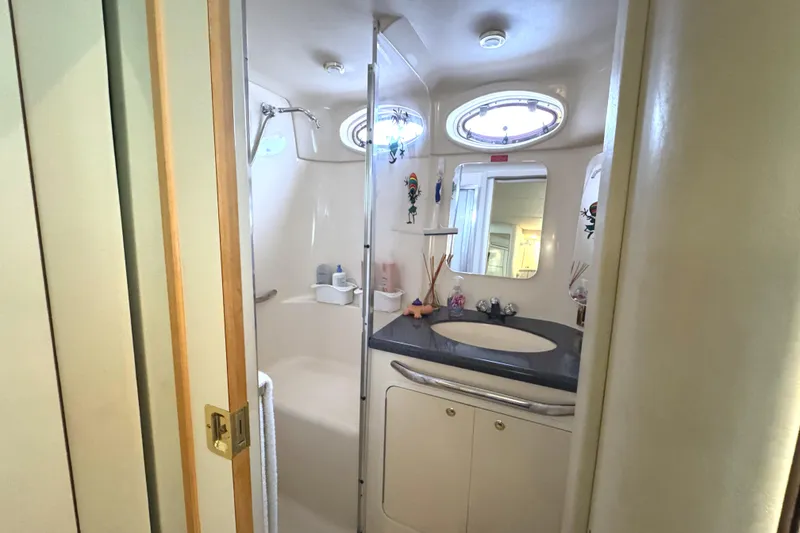 Slide: The Image of Bathroom interior of 1997 Sea Ray 370 Aft Cabin with shower and sink. - 25