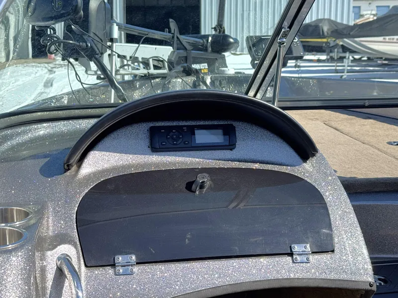 Slide: The Image of Dashboard of a 2013 Triton 190 SE boat with control panel and windshield. - 10