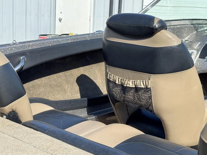 Slide: The Image of Interior of a 2013 Triton 190 SE boat with beige and black seating. - 11