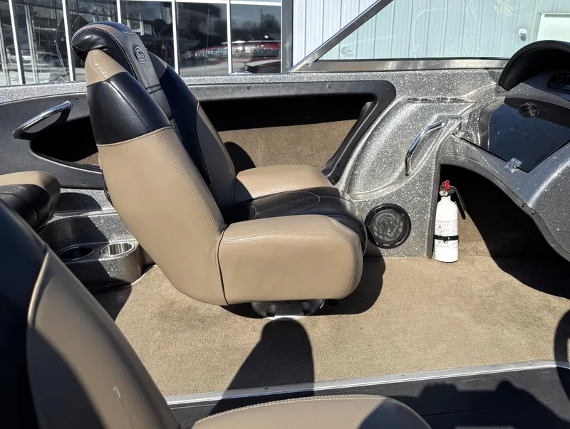 Slide: The Image of Interior of a 2013 Triton 190 SE boat with beige and black seating. - 12