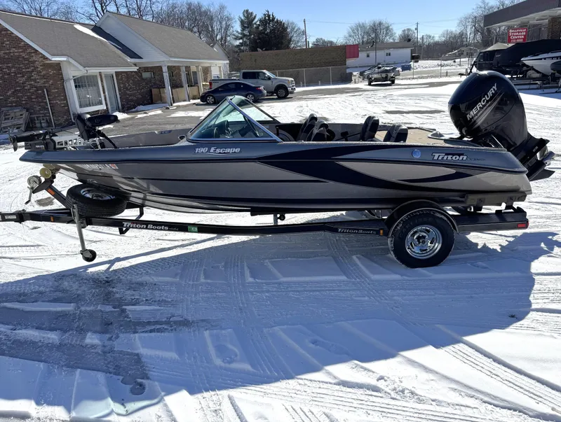 Slide: The Image of 2013 Triton 190 SE boat on trailer in snowy outdoor setting. - 15