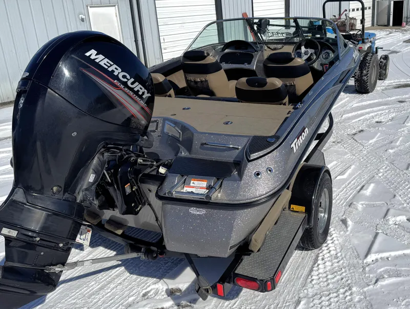 Slide: The Image of 2013 Triton 190 SE boat with Mercury engine on snowy ground. - 20