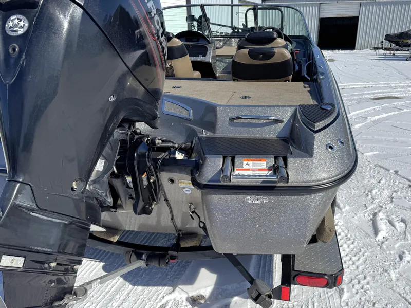 Slide: The Image of 2013 Triton 190 SE boat with Mercury engine on snowy ground. - 9