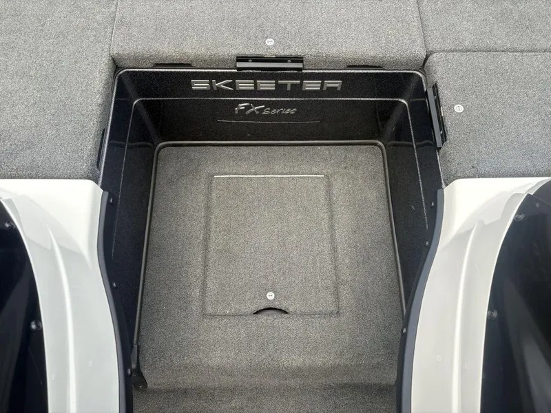 Slide: The Image of 2025 Skeeter FX 20 boat interior with carpeted storage compartment. - 13