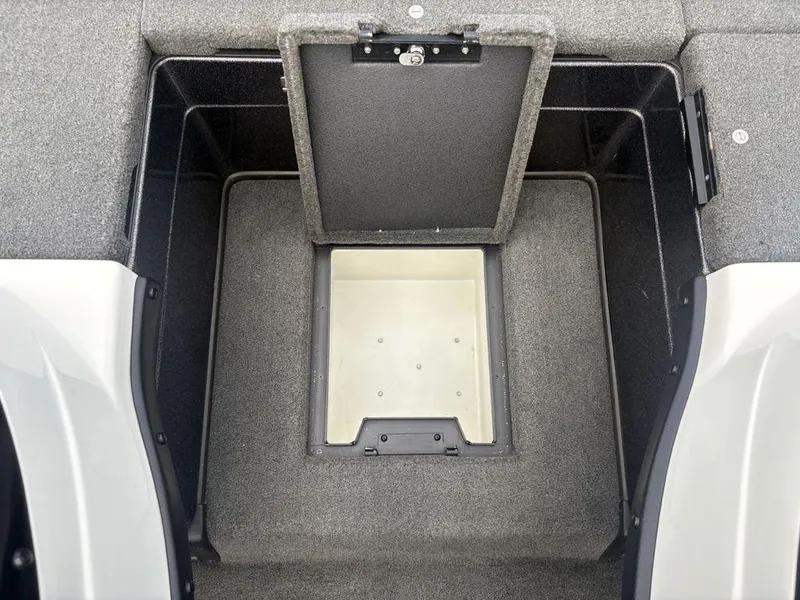 Slide: The Image of 2025 Skeeter FX 20 boat storage compartment with open lid, showcasing interior space. - 14