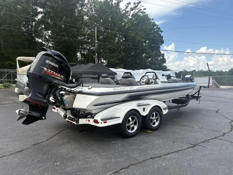 Slide: The Image of 2025 Skeeter FX 20 boat with Yamaha engine on a trailer in a parking lot. - 3