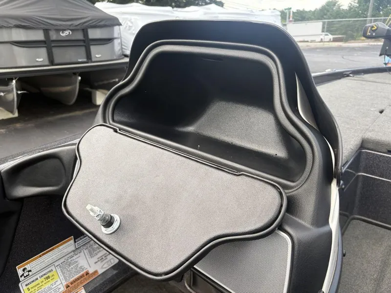 Slide: The Image of Storage compartment on a 2025 Skeeter FX 20 boat, featuring a secure latch. - 7