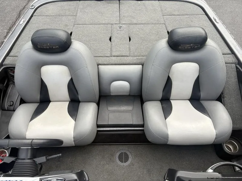 Slide: The Image of 2025 Skeeter FX 20 boat interior with dual gray and white seats. - 8