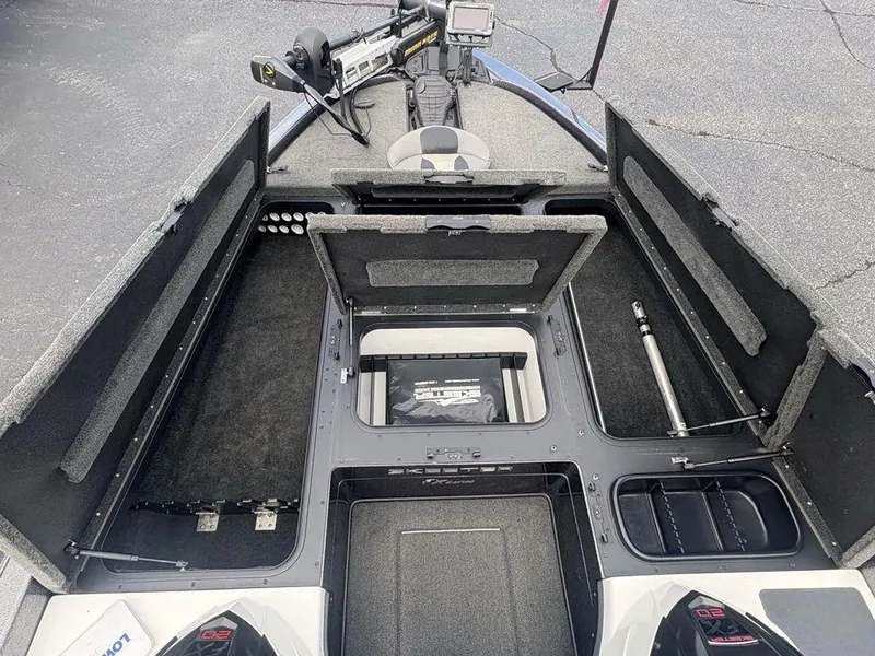 Slide: The Image of 2025 Skeeter FX 20 boat interior with open storage compartments and advanced equipment. - 9