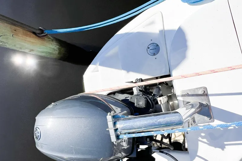 Slide: The Image of Overhead view of a 2012 TomCat 9.70 s boat engine docked with ropes. - 12