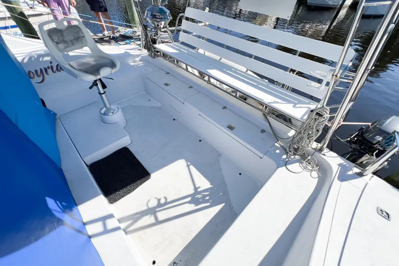 Slide: The Image of White deck of a 2012 TomCat 9.70 s boat with seating and equipment. - 13