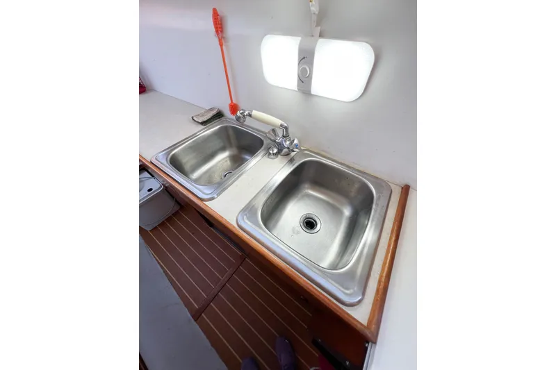 Slide: The Image of Stainless steel double sink in a 2012 TomCat 9.70 s boat kitchen. - 34