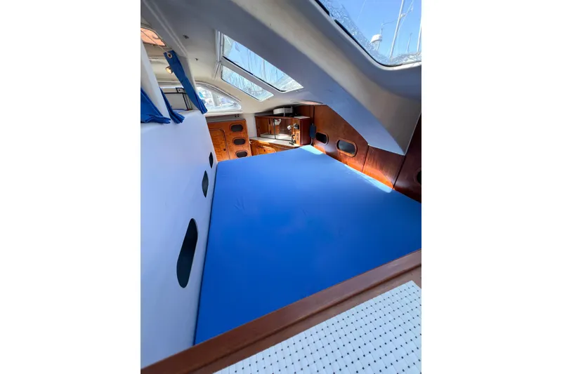 Slide: The Image of Interior cabin of 2012 TomCat 9.70 s catamaran with blue bedding. - 48