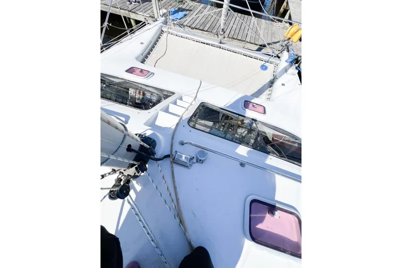 Slide: The Image of Deck view of 2012 TomCat 9.70 s sailboat with visible rigging and hatches. - 53