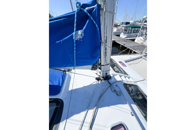Slide: The Image of Sailboat deck view of 2012 TomCat 9.70 s with blue sail cover. - 54
