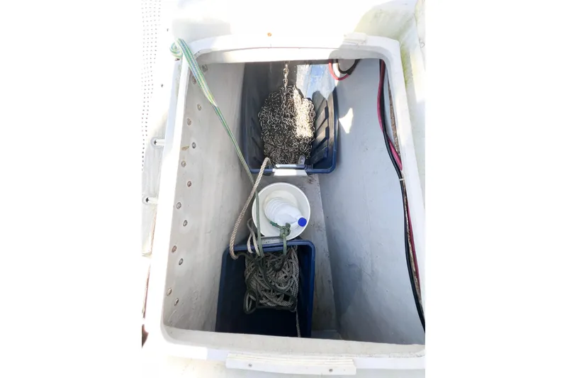 Slide: The Image of Anchor locker of 2012 TomCat 9.70 s boat with ropes and chains. - 57