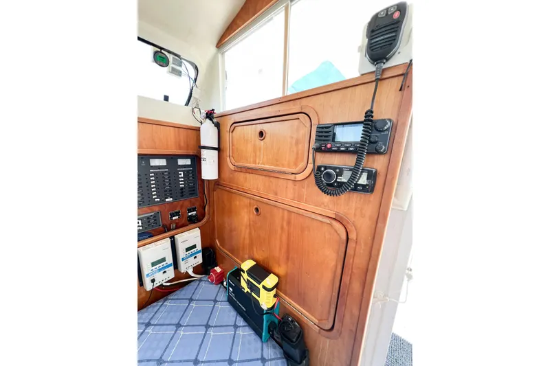 Slide: The Image of Interior of 2012 TomCat 9.70 s boat with control panel and communication equipment. - 59