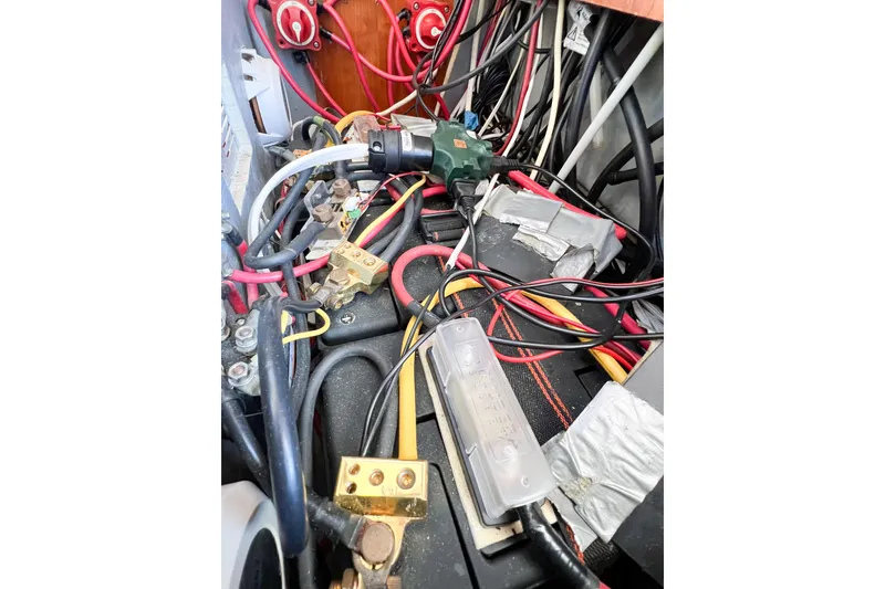 Slide: The Image of Electrical wiring and components inside a 2012 TomCat 9.70 s boat. - 64