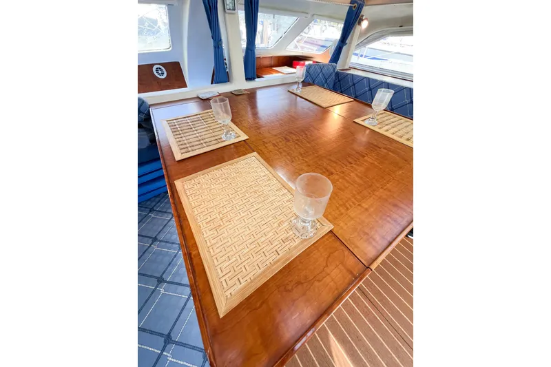 Slide: The Image of Luxurious TomCat 9.70 s 2012 yacht interior with elegant dining table and placemats. - 65