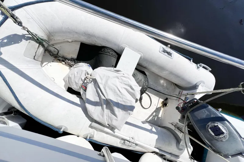 Slide: The Image of Inflatable boat with motor, TomCat 9.70 s, 2012 model, docked on water. - 67
