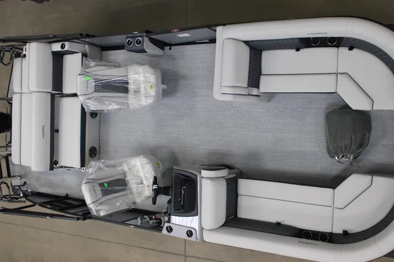 Slide: The Image of 2025 Harris Sunliner 230 pontoon boat interior with plush seating and modern design. - 3