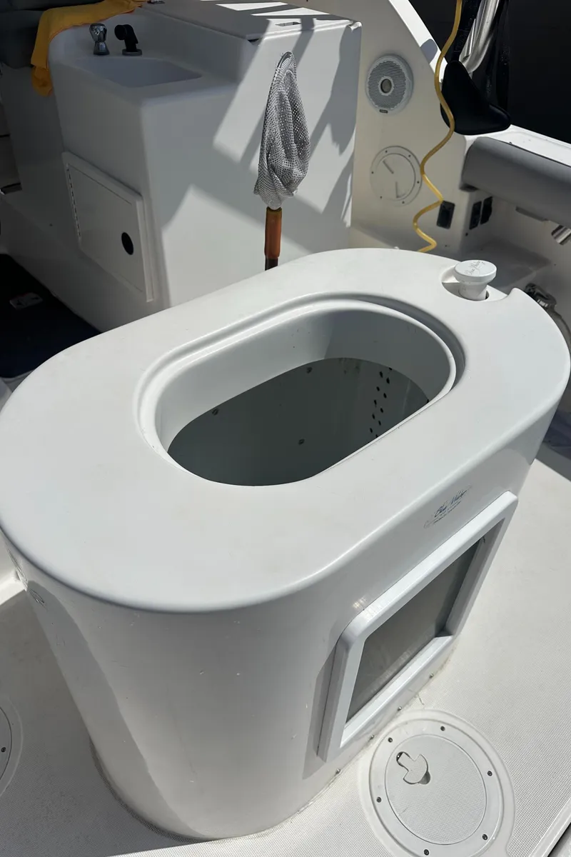 Slide: The Image of 2006 Tiara Yachts 2900 boat interior with storage compartment and sink. - 13