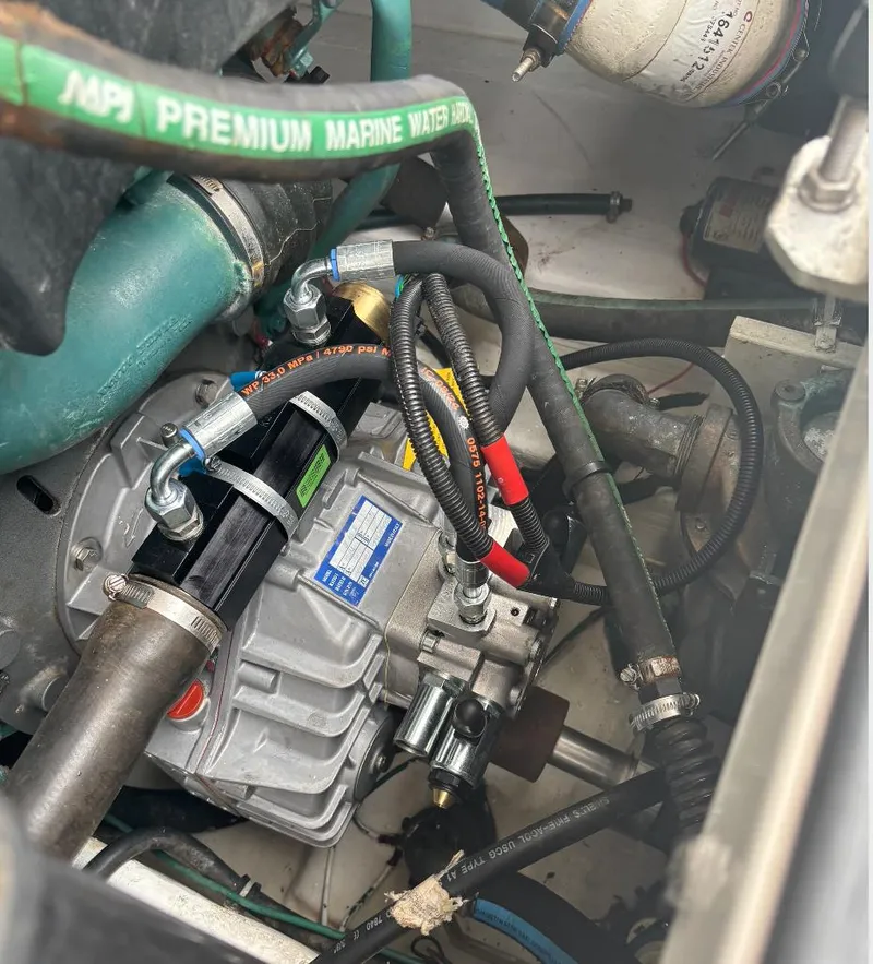 Slide: The Image of Engine compartment of a 2006 Tiara Yachts 2900, featuring marine hoses and components. - 16