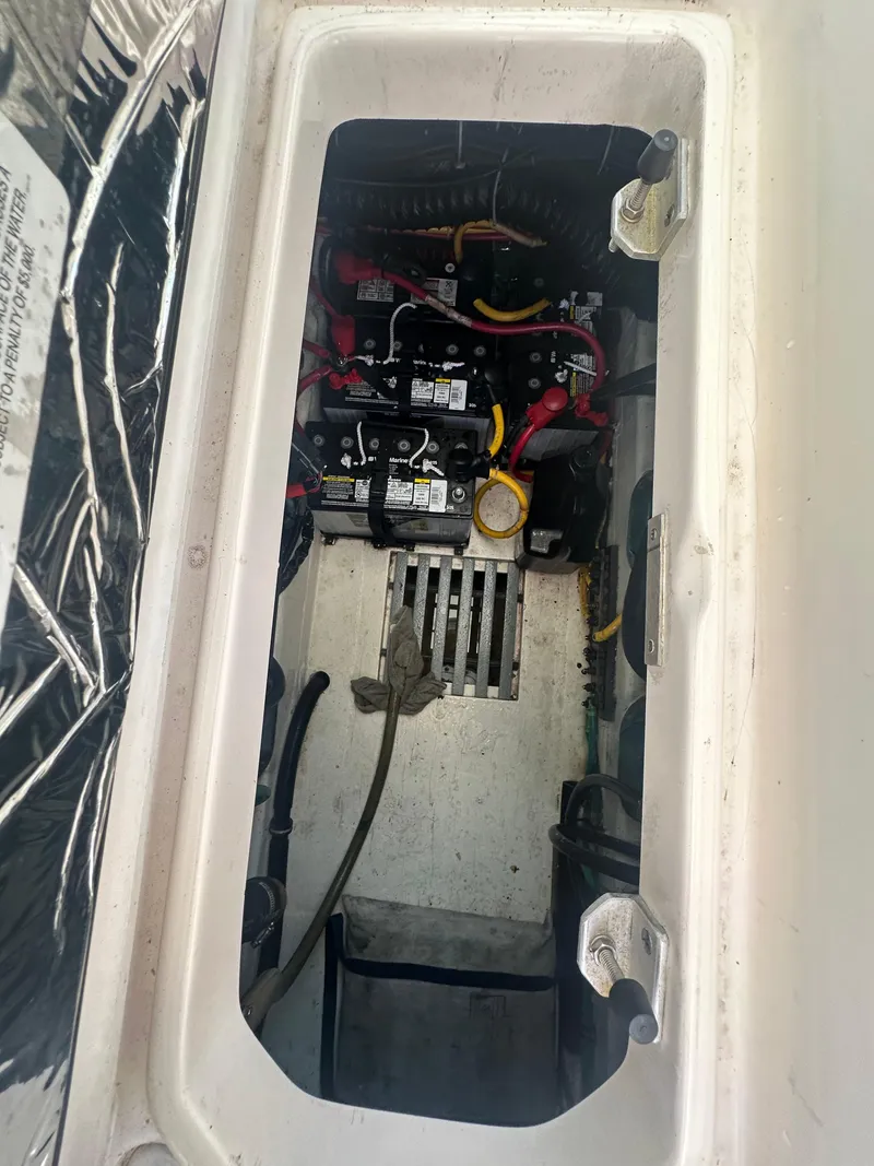 Slide: The Image of Engine compartment of a 2006 Tiara Yachts 2900, showing battery and wiring setup. - 22