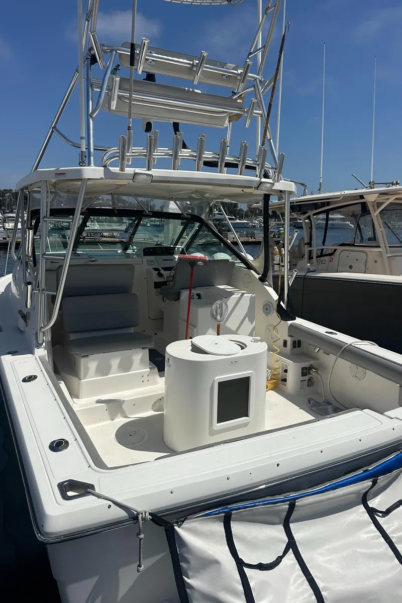 Slide: The Image of 2006 Tiara Yachts 2900 docked at marina under clear sky. - 3