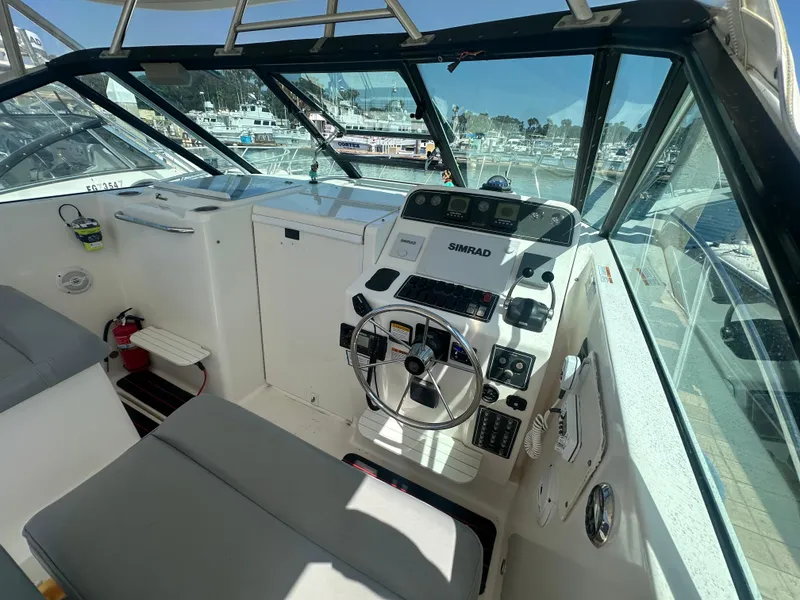 Slide: The Image of Helm of 2006 Tiara Yachts 2900 with Simrad navigation, docked at marina. - 6